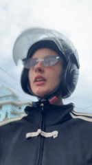Motorcyclist in black helmet and striped jacket recorded in Wichit
