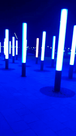 Evening community gathering at illuminated plaza in Magnitogorsk