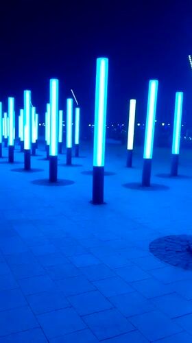 Evening community gathering at illuminated plaza in Magnitogorsk