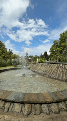 Sochi park fountains and palm walkways on a summer morning