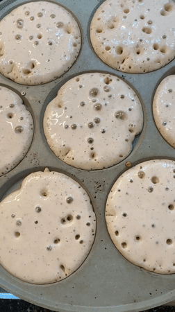 Woman with face tape holds baby in Fethiye home