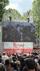Crowd watches military parade on screens in Tbilisi square