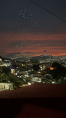 Dramatic sunset colors streak across Caracas skyline Saturday evening