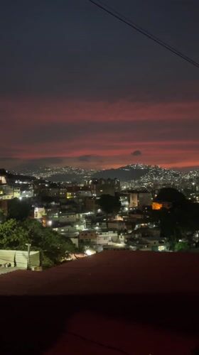 Dramatic sunset colors streak across Caracas skyline Saturday evening