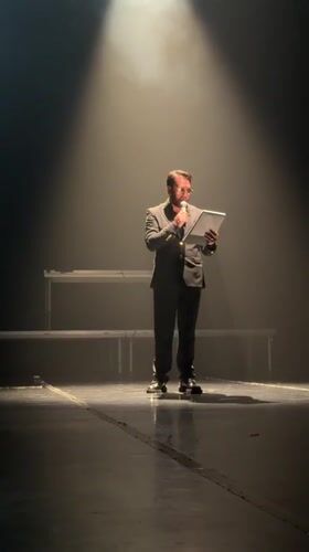 Man delivers stage presentation in Blagoevgrad under colored spotlights