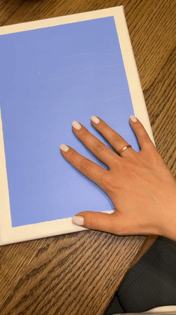 Artist creates handprint canvas painting in Limassol studio session