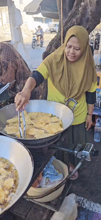 Morning street food preparation captured in Denpasar, Indonesia