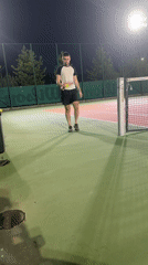 Night tennis in Sofia, crescent moon rising over the city