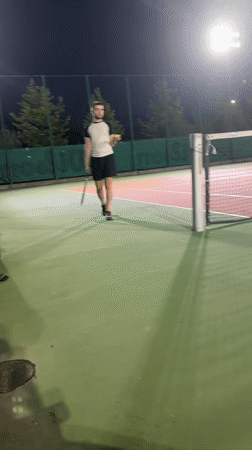 Night tennis in Sofia, crescent moon rising over the city