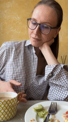 Woman enjoys morning breakfast in Khimki cafe