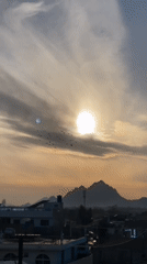 Sunset scenes with birds, children captured across Kandahar cityscape