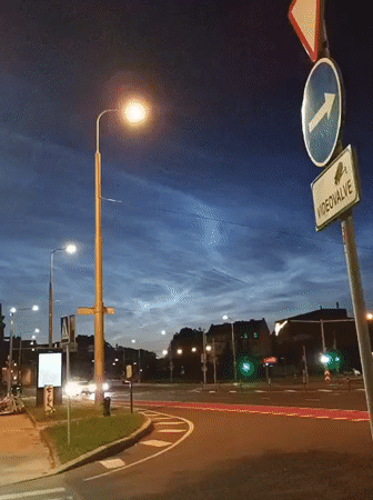 Noctilucent clouds glow over Tallinn streets on a July night