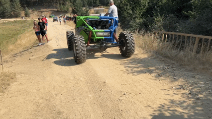 Colorful off-road vehicle draws a crowd on dirt roads in Govedartsi