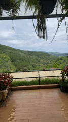 Woman visits scenic mountain café terrace in Vietnam