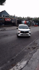 Everyday street life along a busy Pekutatan roadside