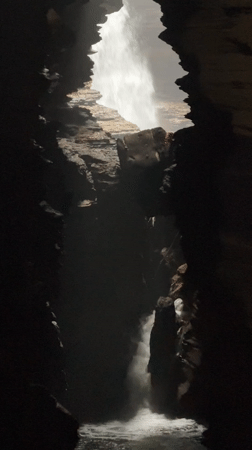 Tourist explores Pokhara caves and Hindu statues during morning visit