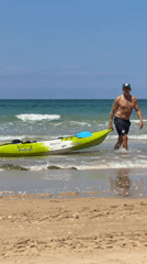 Kayaker returns to shore at Bat Yam beach