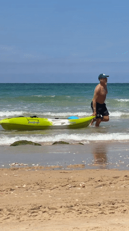 Kayaker returns to shore at Bat Yam beach