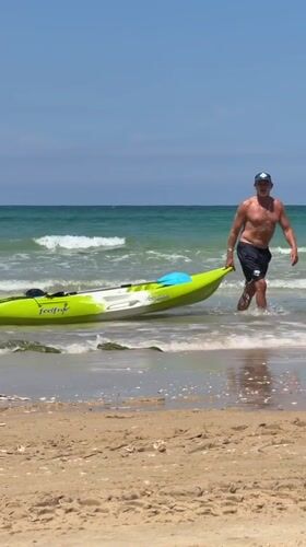 Kayaker returns to shore at Bat Yam beach