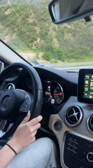 Driver travels highway near Simitli with mountain backdrop