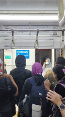 Crowded commuter train interior, Mekarsari, Indonesia