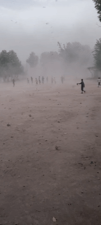 Afternoon soccer on a dusty field in rural Tajikistan