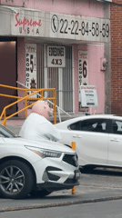Costumed man with pink head spotted outside Puebla business