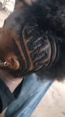 Women share outdoor hair braiding session in Keffi