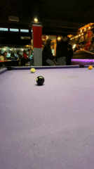 Pool players enjoy casual games at Paris bar