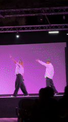 Outdoor stage performance with dancers draws audience in Italian coastal town