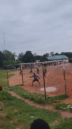 Muddy pickup soccer and street life in Egbagu, Nigeria