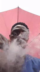 Man with umbrella spotted on Abuja street