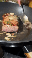 Steak cooked with garlic and rosemary in Sofia wok