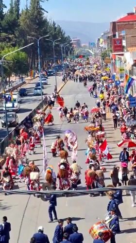Street parade proceeds through Cuzco, Peru