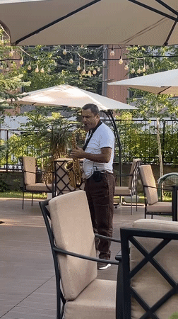 Live saxophone and roaming ducks at a Tsakhkadzor outdoor spot