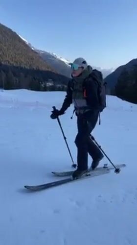 Skiers traverse snowy terrain in Vallorcine, France