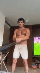 Man exercises with resistance band in Madrid room
