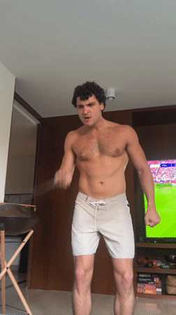 Man exercises with resistance band in Madrid room