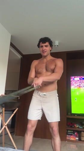 Man exercises with resistance band in Madrid room
