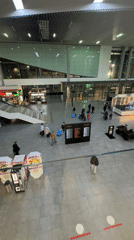 Evening travelers navigate through Bolshoye Savino airport terminal