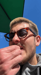 Man enjoys fresh strawberries outdoors in Essen, Germany