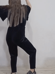 Woman dances, poses with roses in Rusalevka home