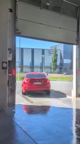 Red car gets thorough wash at Vantaa car facility