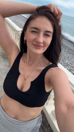 Woman takes seaside selfie from Sochi balcony