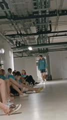 Young people rest in indoor facility corridors