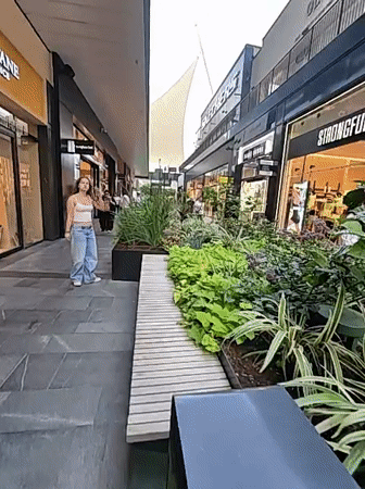 Strolling through a modern outdoor mall in Herzliya