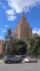 Street-level views of a spired neo-classical landmark in Riga