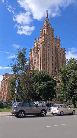 Street-level views of a spired neo-classical landmark in Riga
