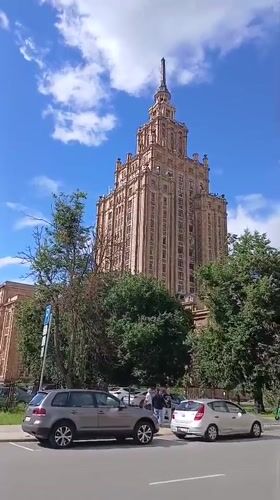 Street-level views of a spired neo-classical landmark in Riga