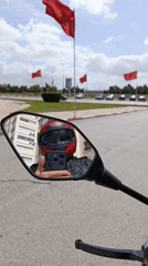 Motorcyclist uses phone while riding in Meknes, Morocco